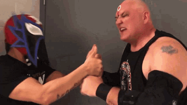 a man with a tattoo on his arm is wearing a shirt that says ' s.r.o.c. ' on it