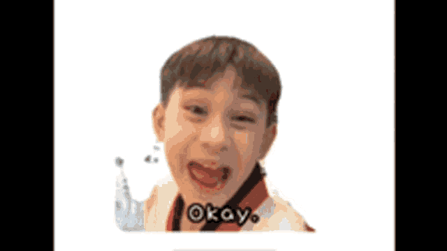 a picture of a young boy with okay written on the bottom