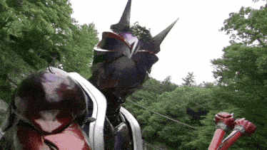 a purple monster with horns is standing in front of a forest