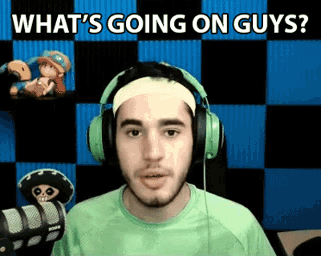 a man wearing green headphones and a headband says what 's going on guys
