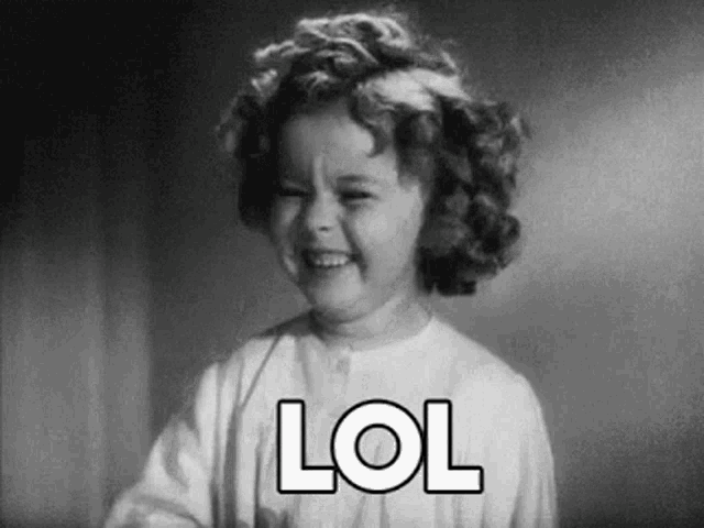 a black and white photo of a little girl making a funny face and saying lol .