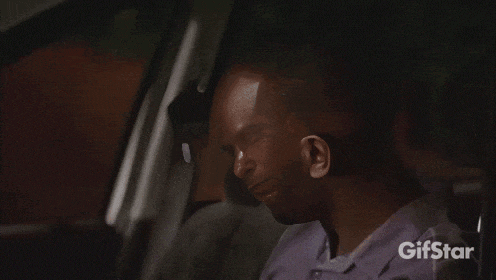 a man in a car with a gifstar logo