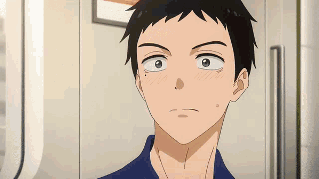 a close up of a man 's face with a slight smirk on his face