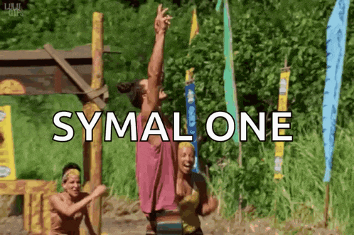 a group of people are standing in a field with the word symalone above them .