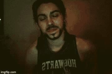 a man with a beard and long hair is wearing a black tank top with the word strawdon on it .