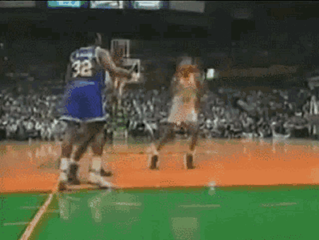 a basketball player with the number 32 on his shirt