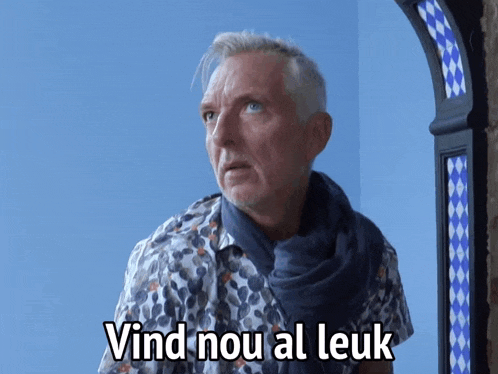 a man with a scarf around his neck and the words vind nou al leuk written below him