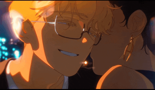 a man with glasses is kissing another man on the forehead