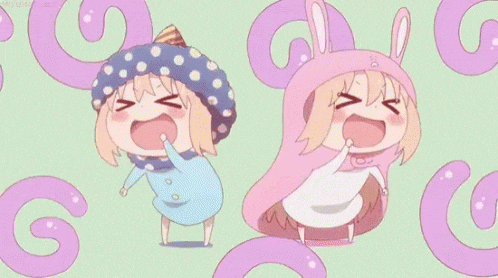 a couple of anime girls are standing next to each other and smiling .