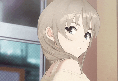 a close up of a girl 's face with a serious expression
