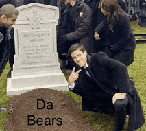 a man kneeling in front of a grave with the words da bears on it