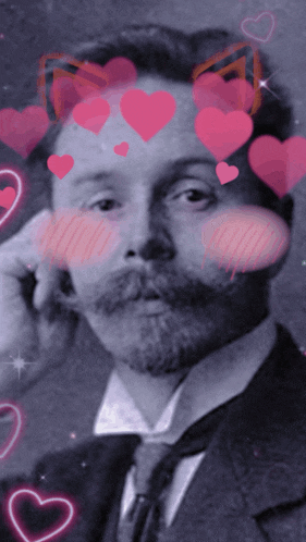 a man in a suit and tie with pink hearts around his face