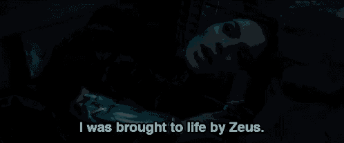 a woman laying down with the words " i was brought to life by zeus " on the bottom