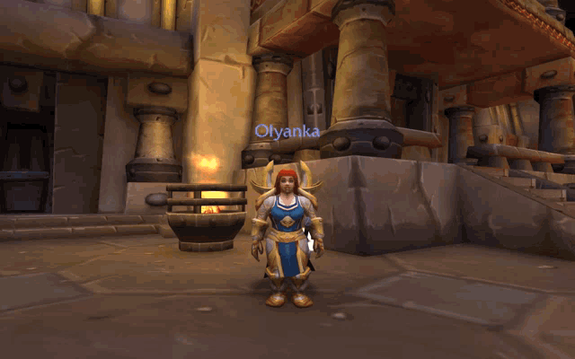 a video game character named olyanka is standing in front of a stone building