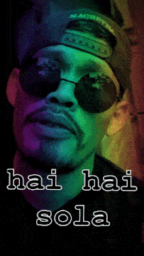 a man wearing sunglasses and a hat that says macbeth