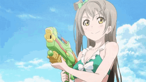 a girl in a green bikini holds a green water gun