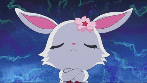 a rabbit with a pink flower on its head