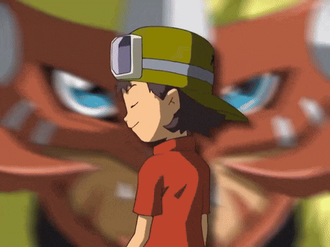 a boy wearing a yellow hat and goggles is standing in front of a monster