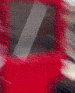 a blurry picture of a person in a red van