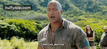 the rock is standing in a field with his eyes closed and says `` don 't cry , don 't cry '' .
