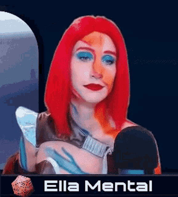 a woman with red hair is talking into a microphone with the name ella mental on the bottom