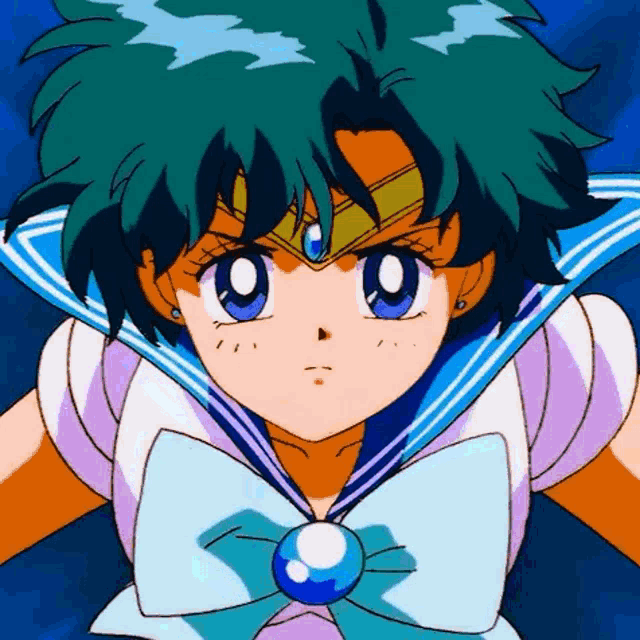 a close up of a sailor moon character with a blue bow