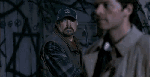 a man in a trench coat is talking to another man and the caption says #bitch dont even