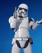 a stormtrooper from star wars is holding a gun against a blue sky .