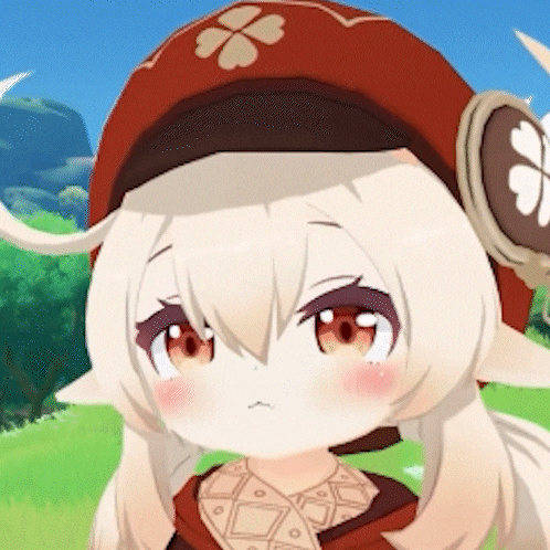a close up of a girl wearing a red hat with a clover on it .