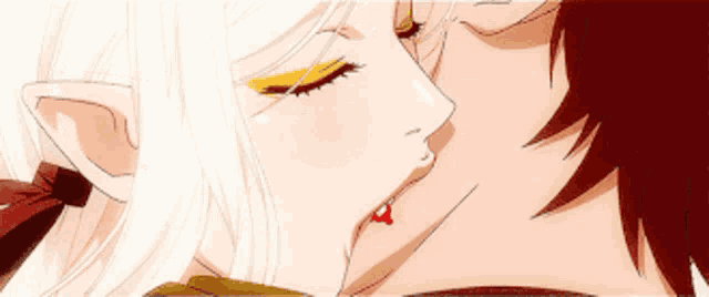a man and a woman are kissing with blood coming out of their lips