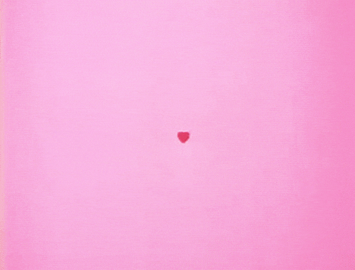 a pink background with many red hearts and white dots