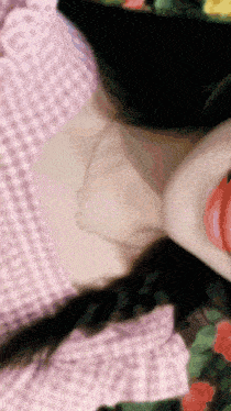 a close up of a woman 's neck with a necklace around her neck