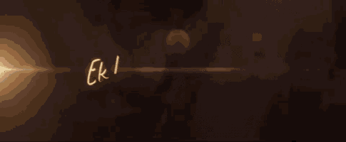 the word ek la is written in gold on a dark background