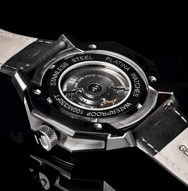 three watches are displayed on a display stand that says " tatina "