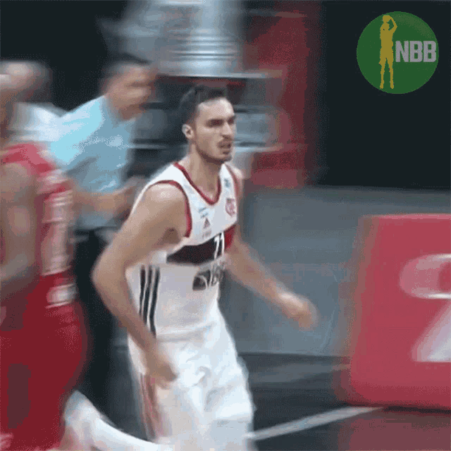 a man in a basketball uniform with the number 21 on it