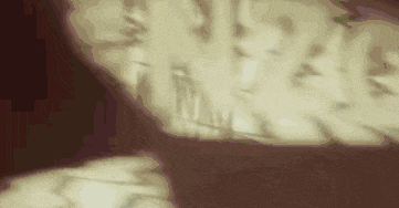 a shadow of a person is cast on a wall in a dark room