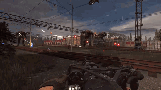 a person is holding a gun in a video game while a train is coming down the tracks