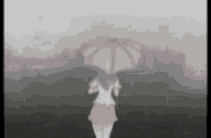 a girl with a pink umbrella is standing in the rain .