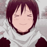 a close up of a person wearing a scarf with their eyes closed