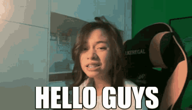 a girl says hello guys while sitting in a likeregal chair