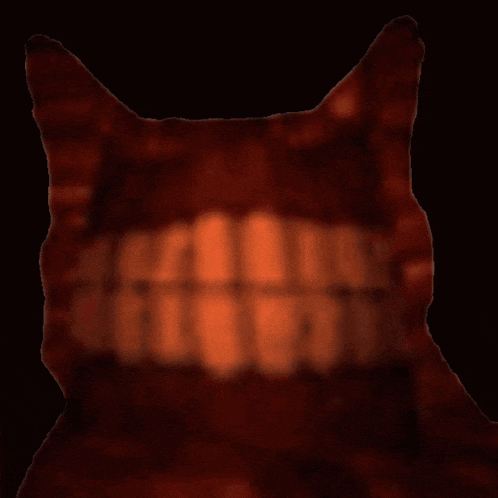 a blurred image of a cat 's mouth with teeth