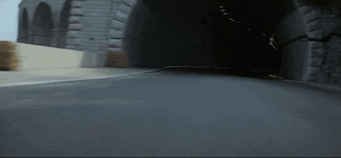 a blurred image of a race car driving down a street