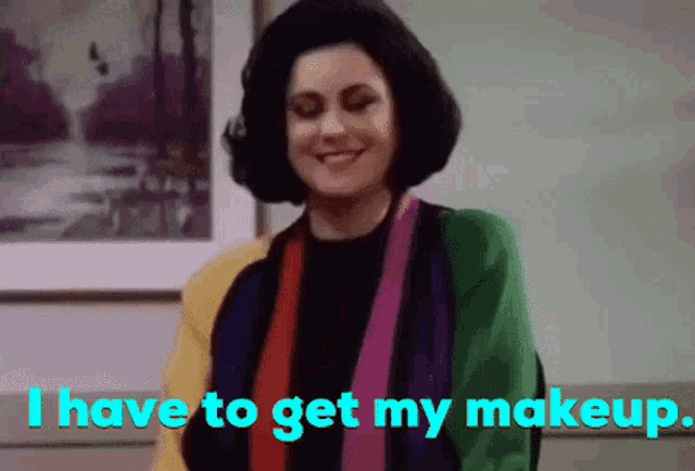 a woman says i have to get my makeup in front of a picture