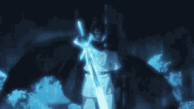 a man in a cape is holding a sword in his hand .