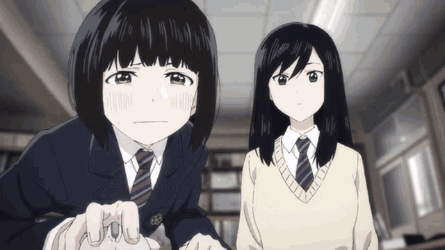 two anime girls standing next to each other in a room