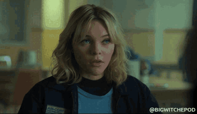 a woman with a name tag that says am-corps