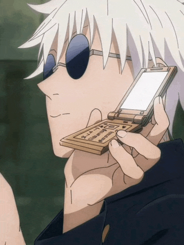 a man wearing sunglasses is holding a flip phone that says ' x ' on it