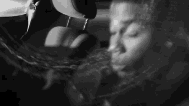 a black and white photo of a person with headphones