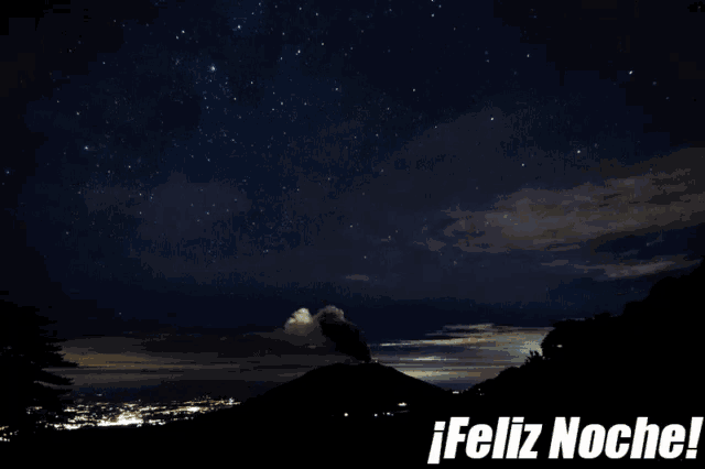 a picture of a volcano at night with the words feliz noche below it
