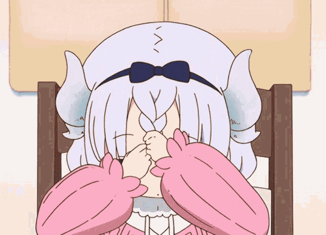 a cartoon drawing of a girl with horns covering her face with her hands